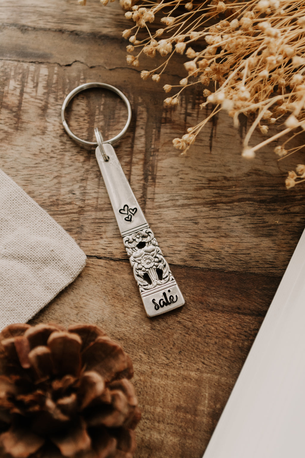 Porte-clé "bisou salé" - sous le sable design - grisbleu