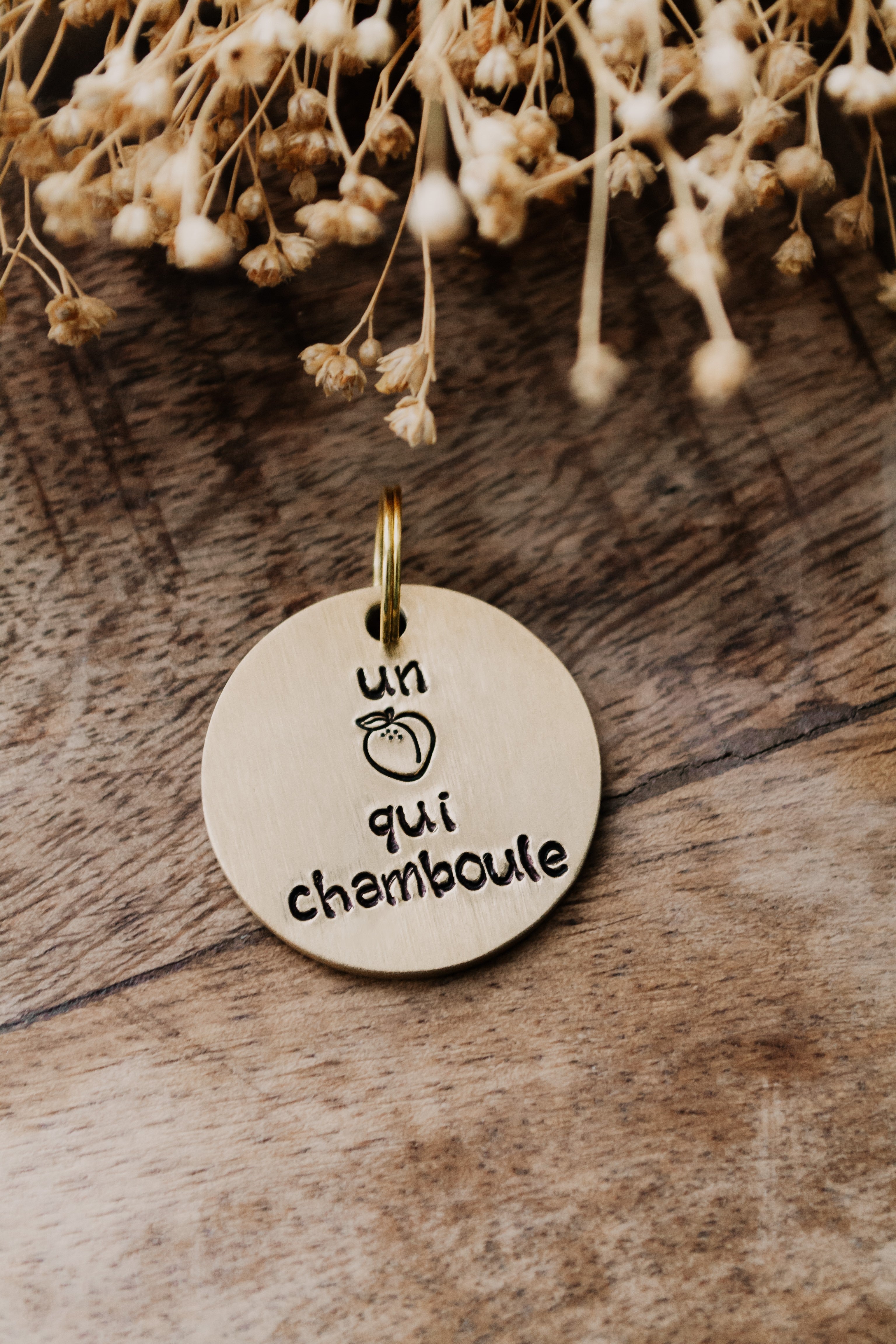 Porte-clé "un ... qui chamboule" - sous le sable design - grisbleu